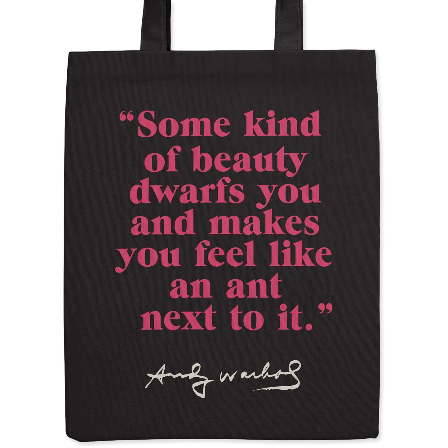 Black tote bag with a quotation by Andy Warhol printed in pink.