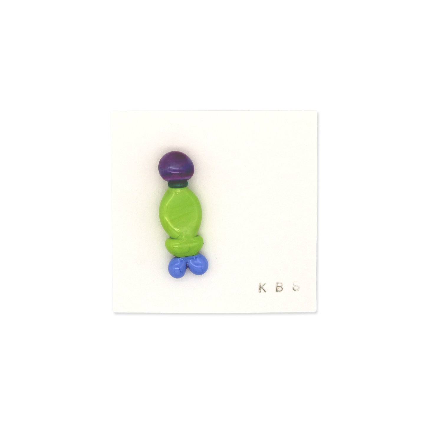 Colorful glass brooch by Krista Bermeo Studio. Purple, green, and light blue.
