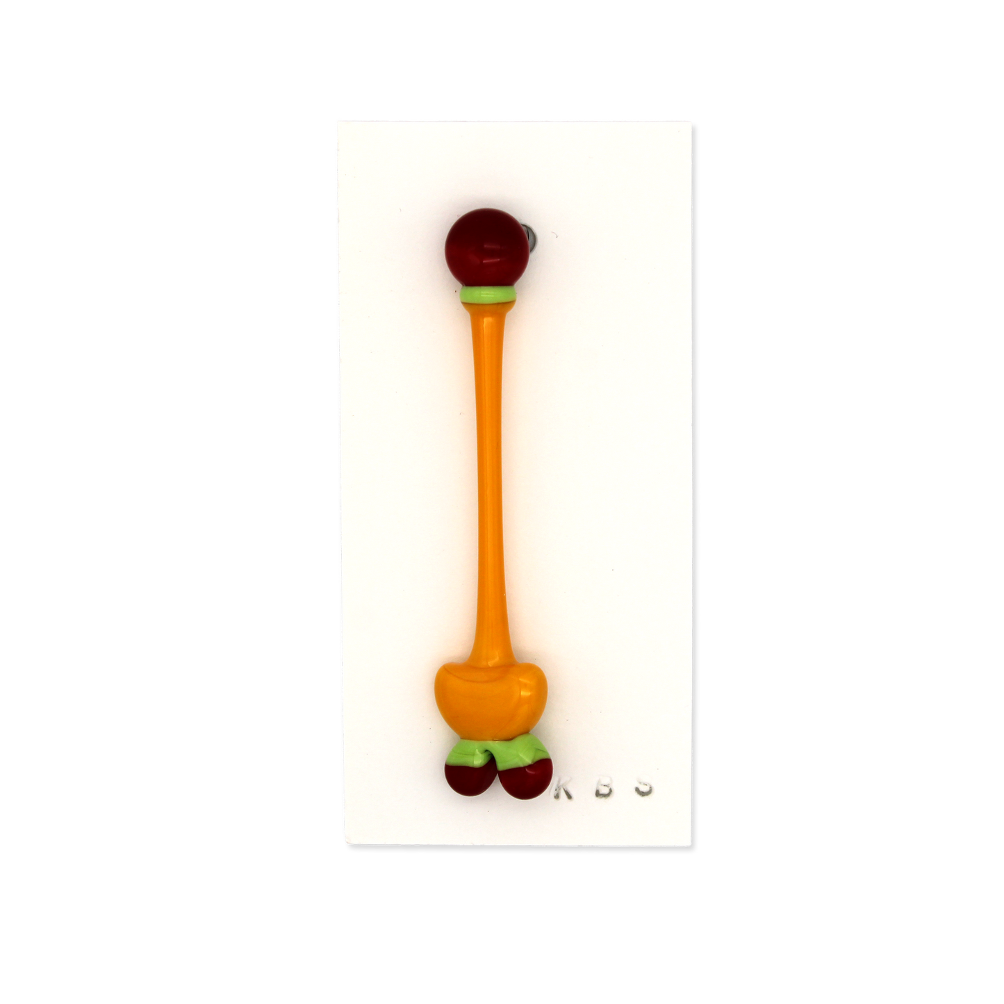 Glass pin/brooch by Krista Bermeo in sunny yellow, with red and green accents.