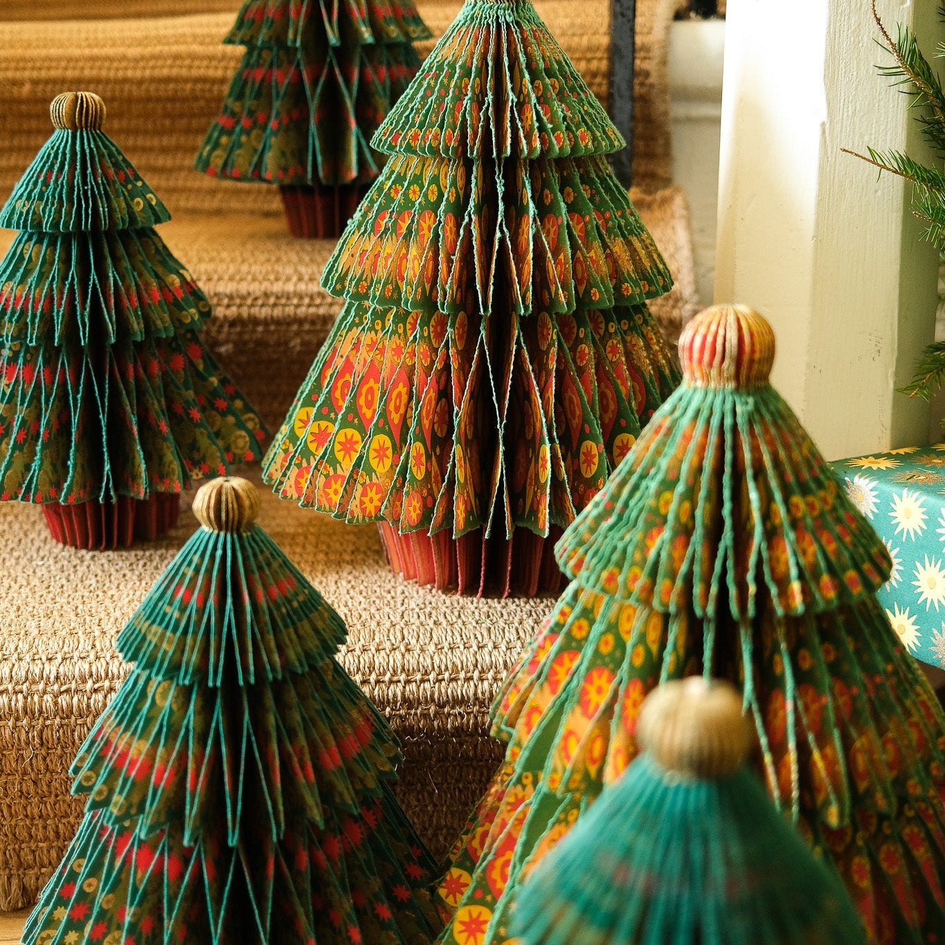 Colorful paper Christmas trees on a staircase