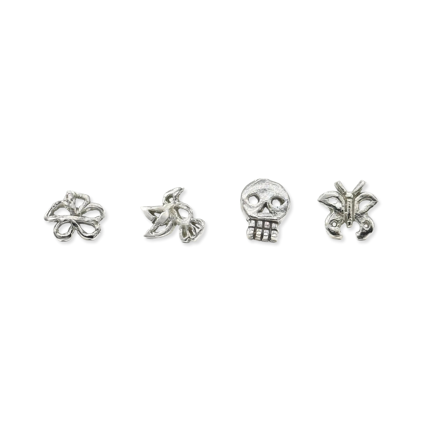 Tiny silver stud earrings: flower, bird, skull, butterfly