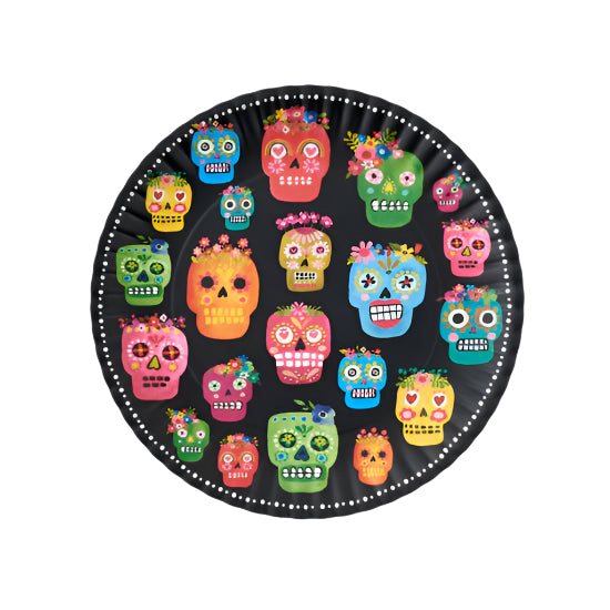 Round black plate with colorful sugar skull designs on a white background