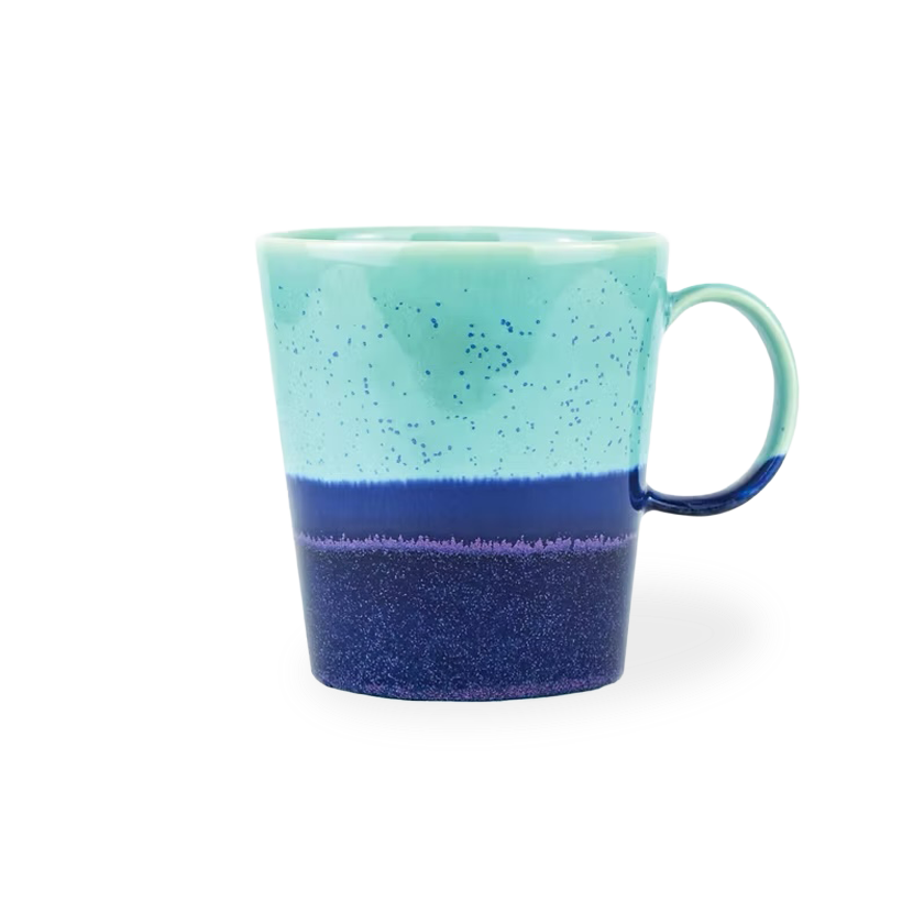 Turquoise and blue ceramic mug on a white background