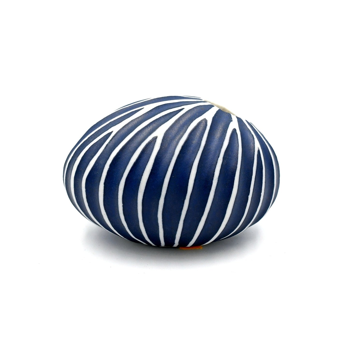 Blue and white striped vase on a white background