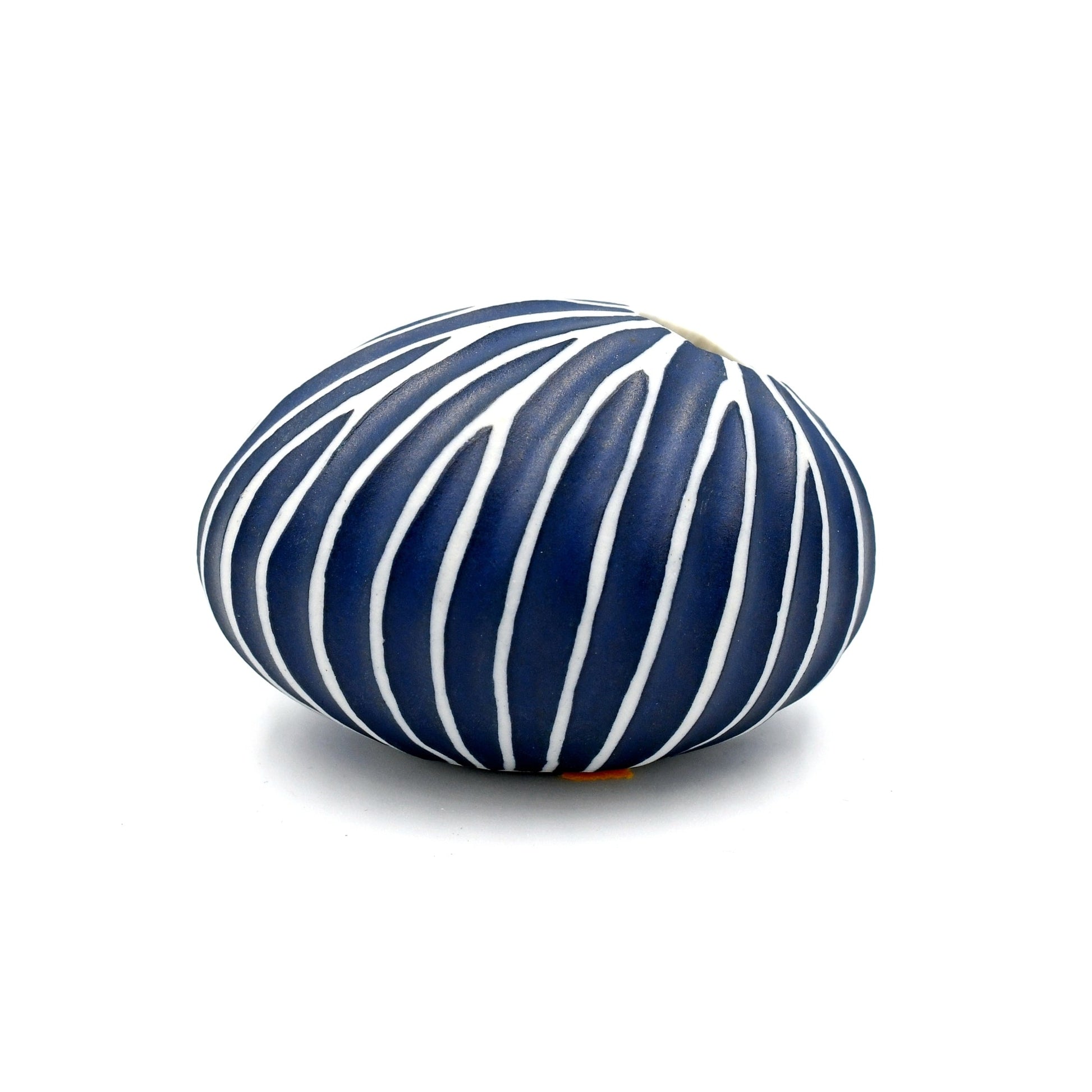 Blue and white striped vase on a white background