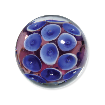 Glass marble with blue and purple bubble design on a white background