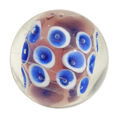 Glass marble with blue and white cellular pattern on a white background