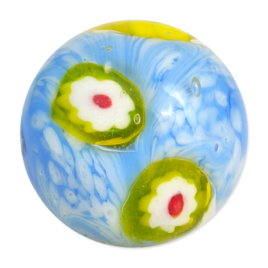Decorative glass marble with blue, green, and white swirls on a white background
