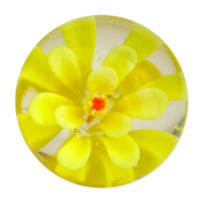 Round yellow glass marble with a central red feature on a white background