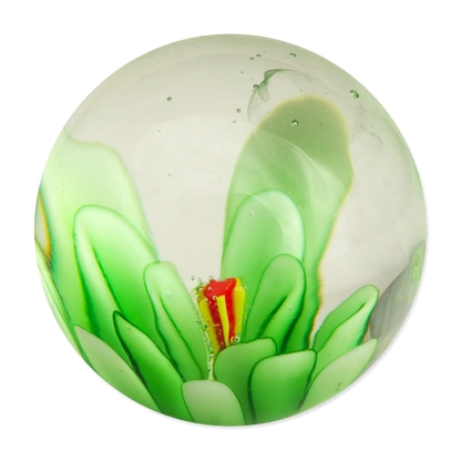 Green glass marble with a red and yellow center on a white background