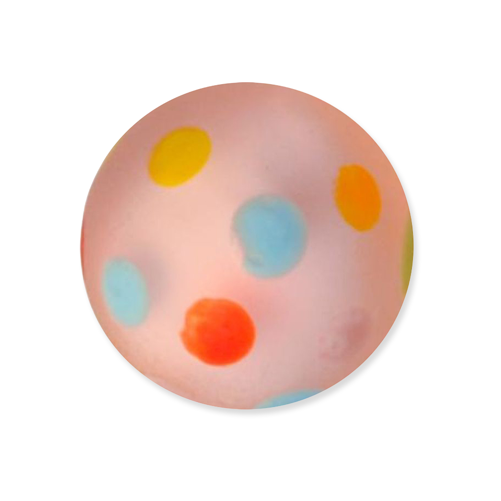Round glass marble with colorful polka dots on a white background