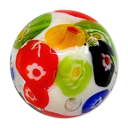Colorful glass marble with floral patterns on a white background