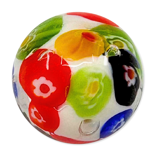 Colorful glass marble with floral patterns on a white background