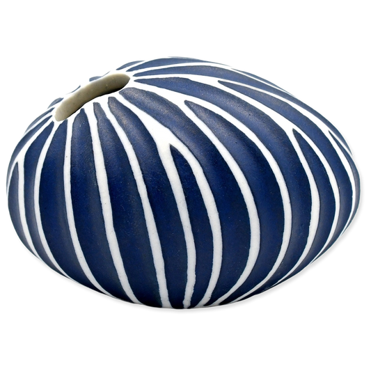 Decorative mini vase with blue and white striped pattern on a white background