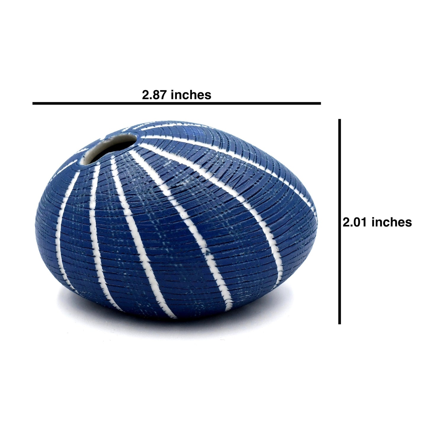 Blue vase with white stripes and measurements on a white background