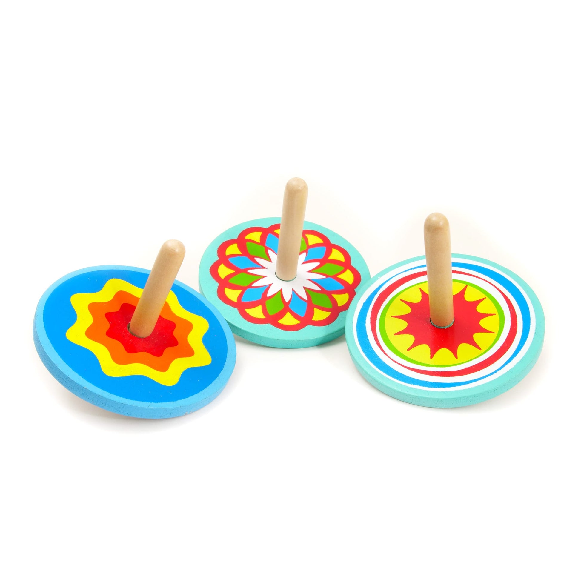 Three colorful wooden spinning tops on a white background