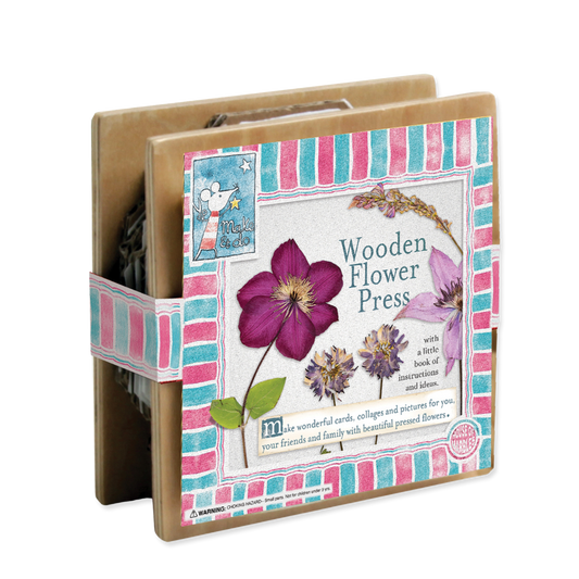Wooden flower press with floral design and text on packaging
