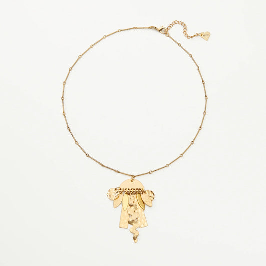Golden brass necklace with a pendant of abstract shapes suspended from a semi-circle.