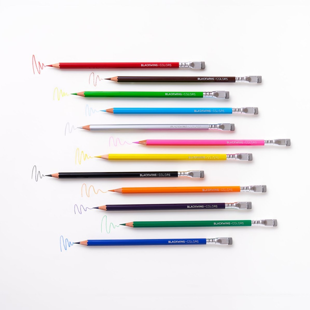 Set of colorful pencils with erasers on a white background