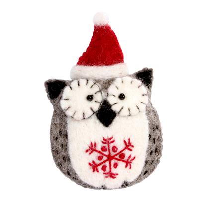 Felted owl ornament with red snowflake design and Santa hat on a white background