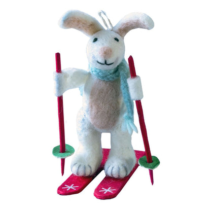 Skiing Bunny ornament with ski poles against a white background