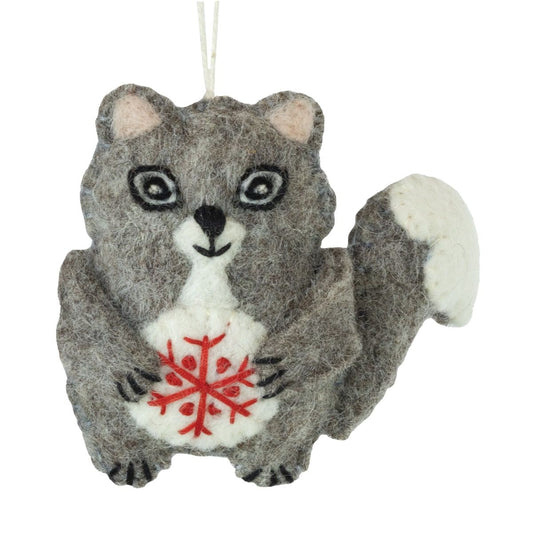 Felted animal ornament of a squirrel holding a red snowflake on a white background