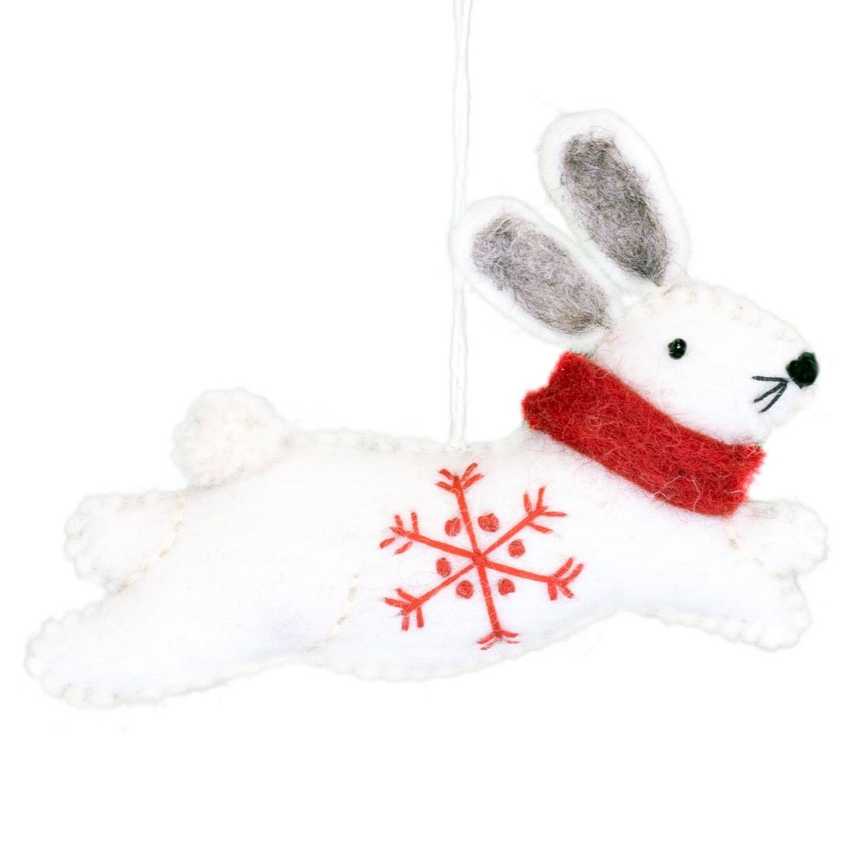 White rabbit ornament with a red scarf and snowflake design on a white background