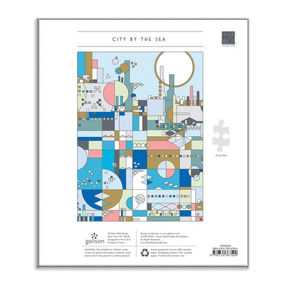 Puzzle packaging with geometric city design and 'City by the Sea' text on a white background