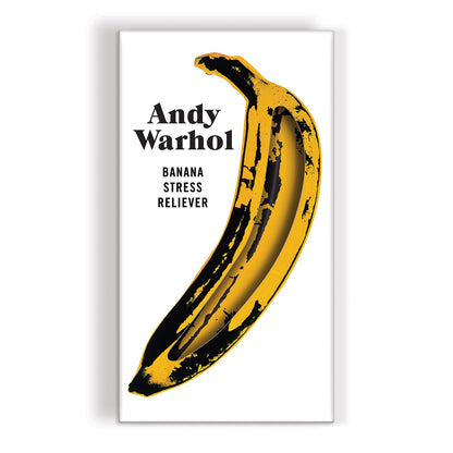 Yellow banana with black splashes on a white background, featuring the text 'Andy Warhol Banana Stress Reliever'.