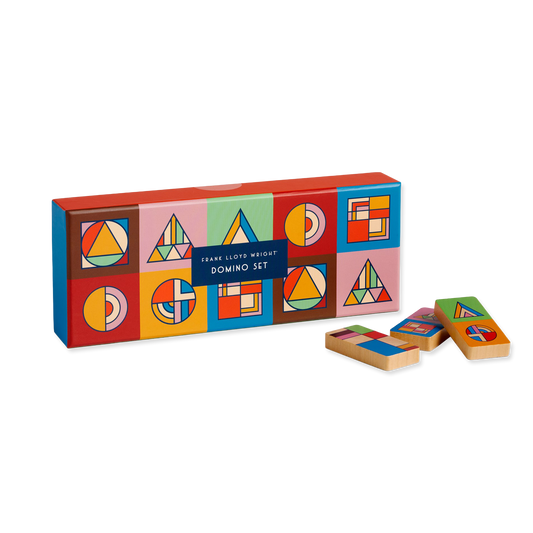 Colorful geometric-patterned domino set with packaging on a white background