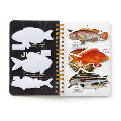 Open notebook with fish illustrations on a white background