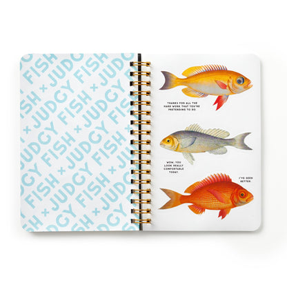 Notebook with fish illustrations and text on a white background