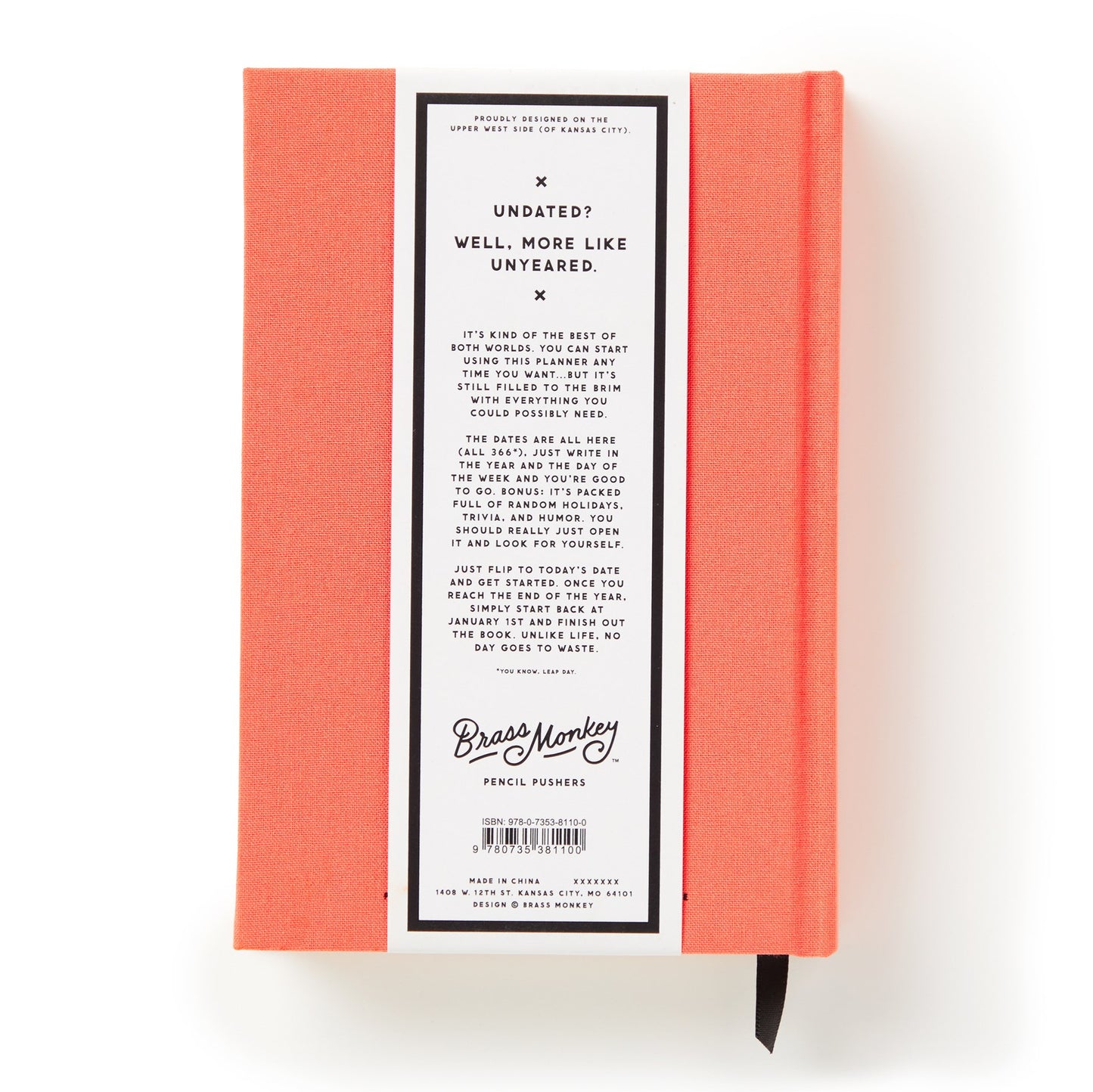 Red notebook with a label on a white background