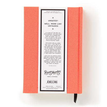 Red notebook with a label on a white background