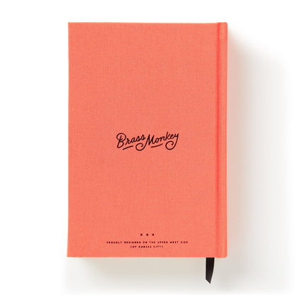 Coral notebook with 'Brass Monkey' branding on a white background