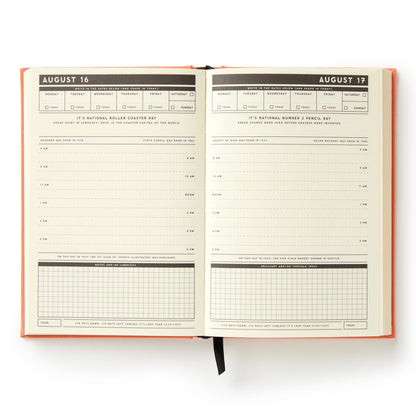 Open planner showing a two-page spread with dates and time slots.