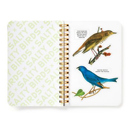 Notebook with bird illustrations and text on a white background