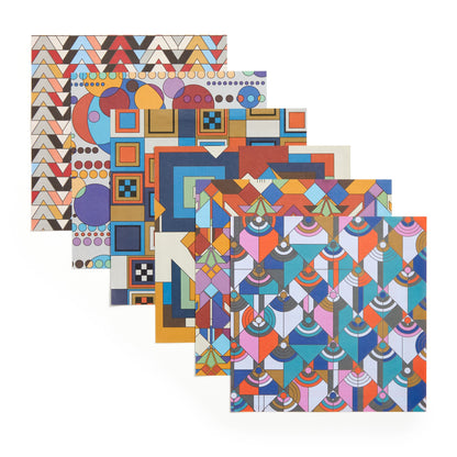 Set of four geometric patterned notebooks on a white background