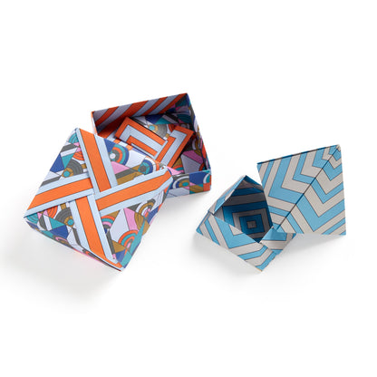 Two geometric patterned boxes on a white background