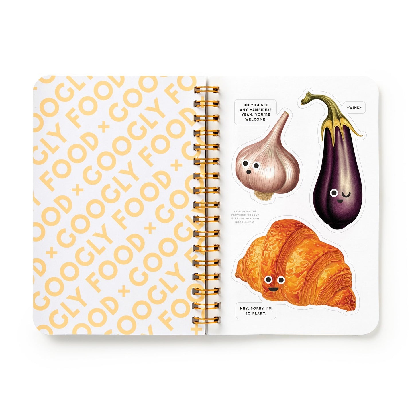 Notebook with cartoon garlic, eggplant, and croissant on a white background