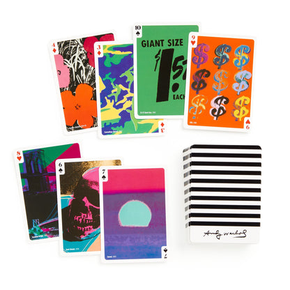 Colorful playing cards with various designs on a white background