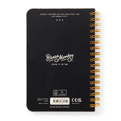 Black notebook with gold spiral binding and 'Brass Monkey' branding on a white background