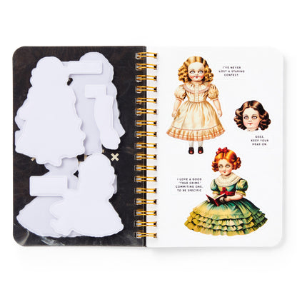 Notebook with vintage-style doll illustrations on a white background