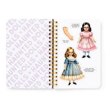 Notebook with vintage-style doll illustrations and text on a white background