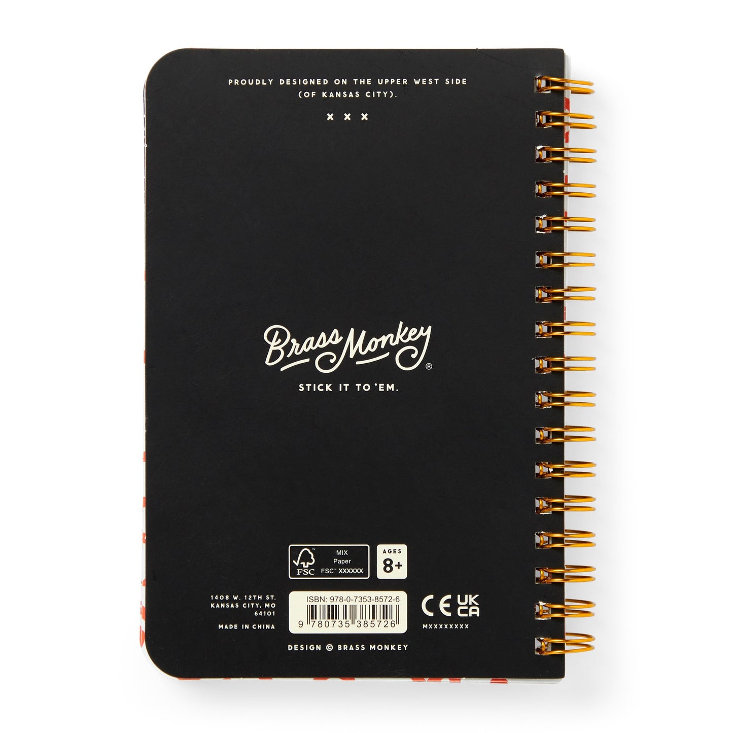 Black notebook with gold spiral binding and Brass Monkey branding on a white background
