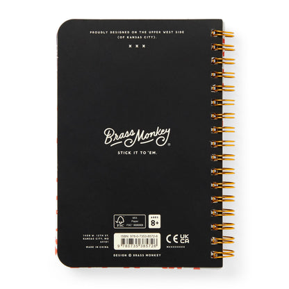 Black notebook with gold spiral binding and Brass Monkey branding on a white background
