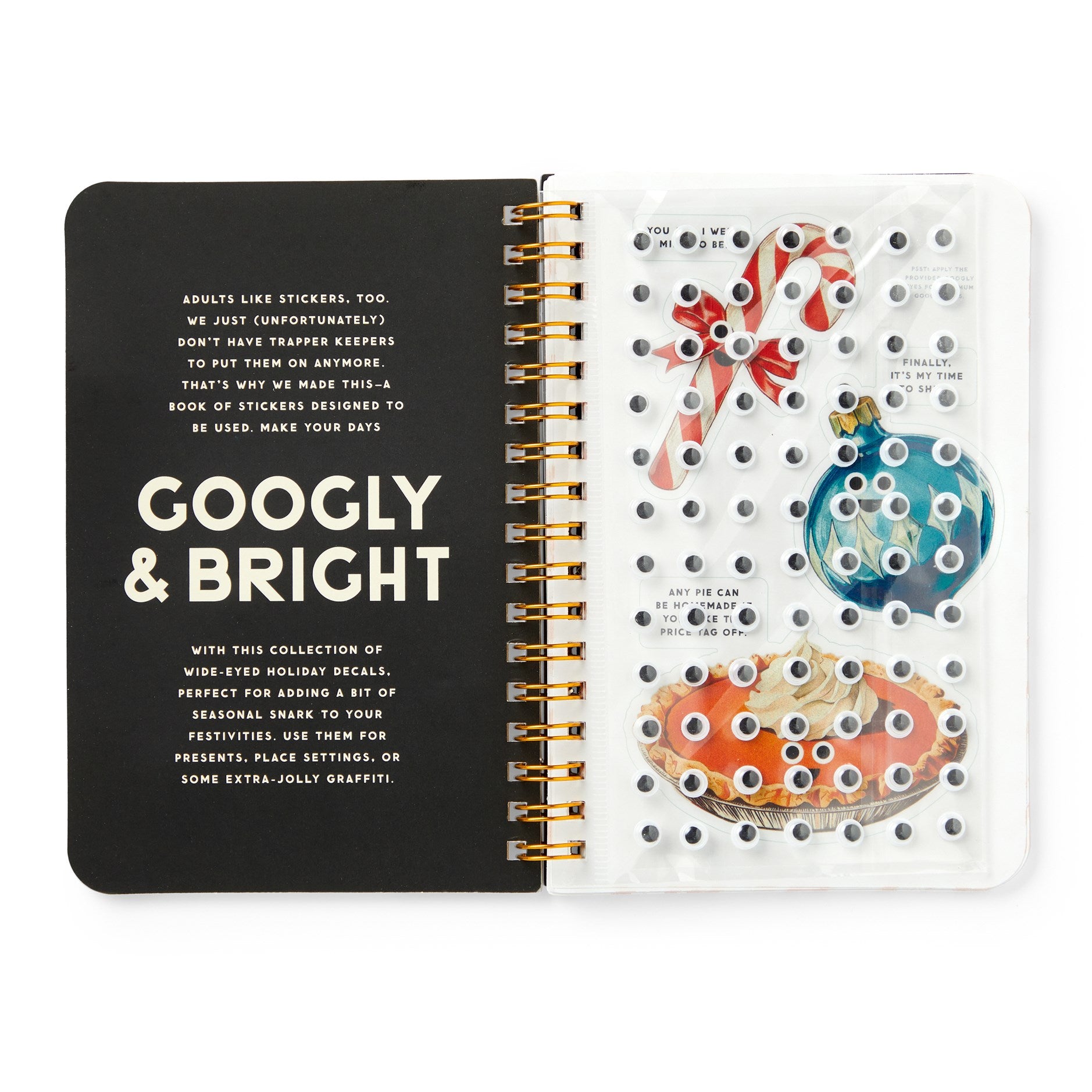 Open notebook with decorative stickers on a white background