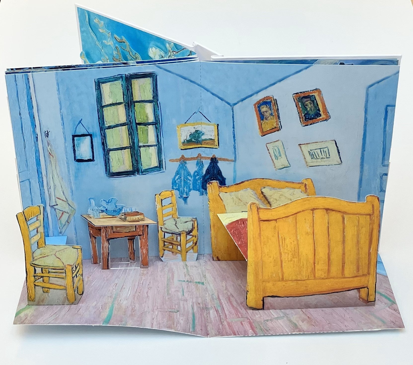 Pop-up book with a room scene featuring furniture and decor.