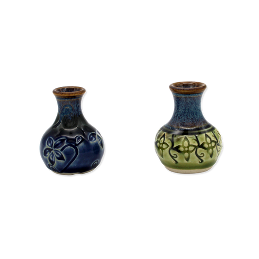 Two ceramic vases with decorative patterns on a white background