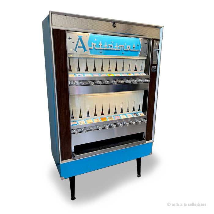 Vintage-style vending machine with a blue base and silver top on a white background